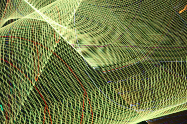 abstract green light trails on black background