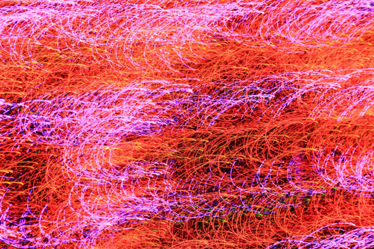 abstract light trails in red and purple
