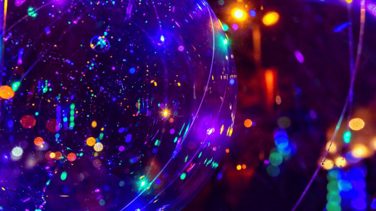 abstract orb with festive colourful light streaks